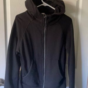 Zyia full-zip, fitted black sweatshirt with thumb holes